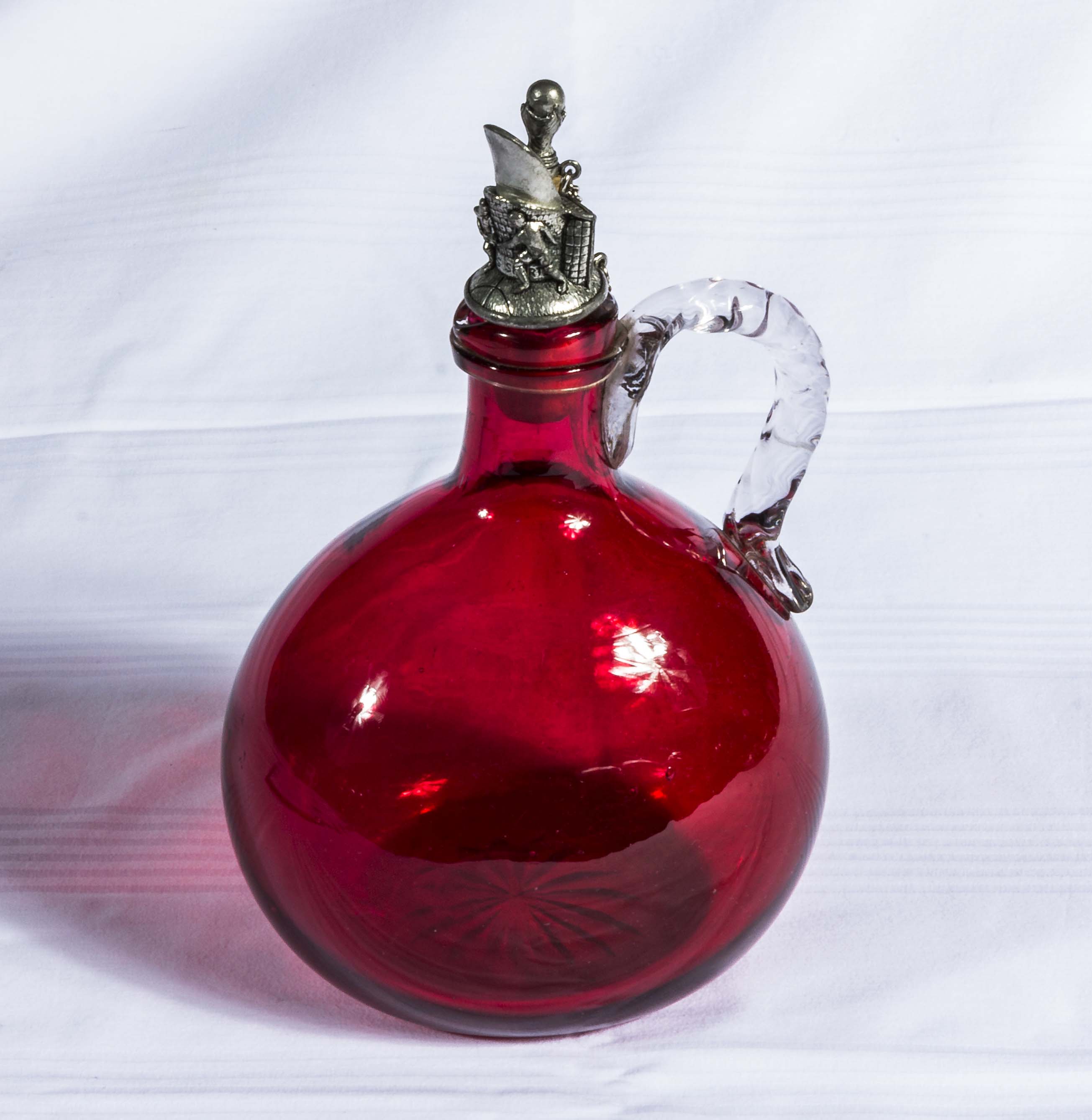 A cranberry glass decanter