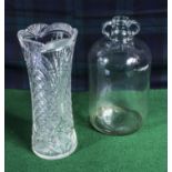A glass vase and a bottle