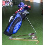 A set of golf clubs, two shooting sticks and a walking stick