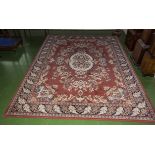 A large red ground carpet size 330cm x 240cm