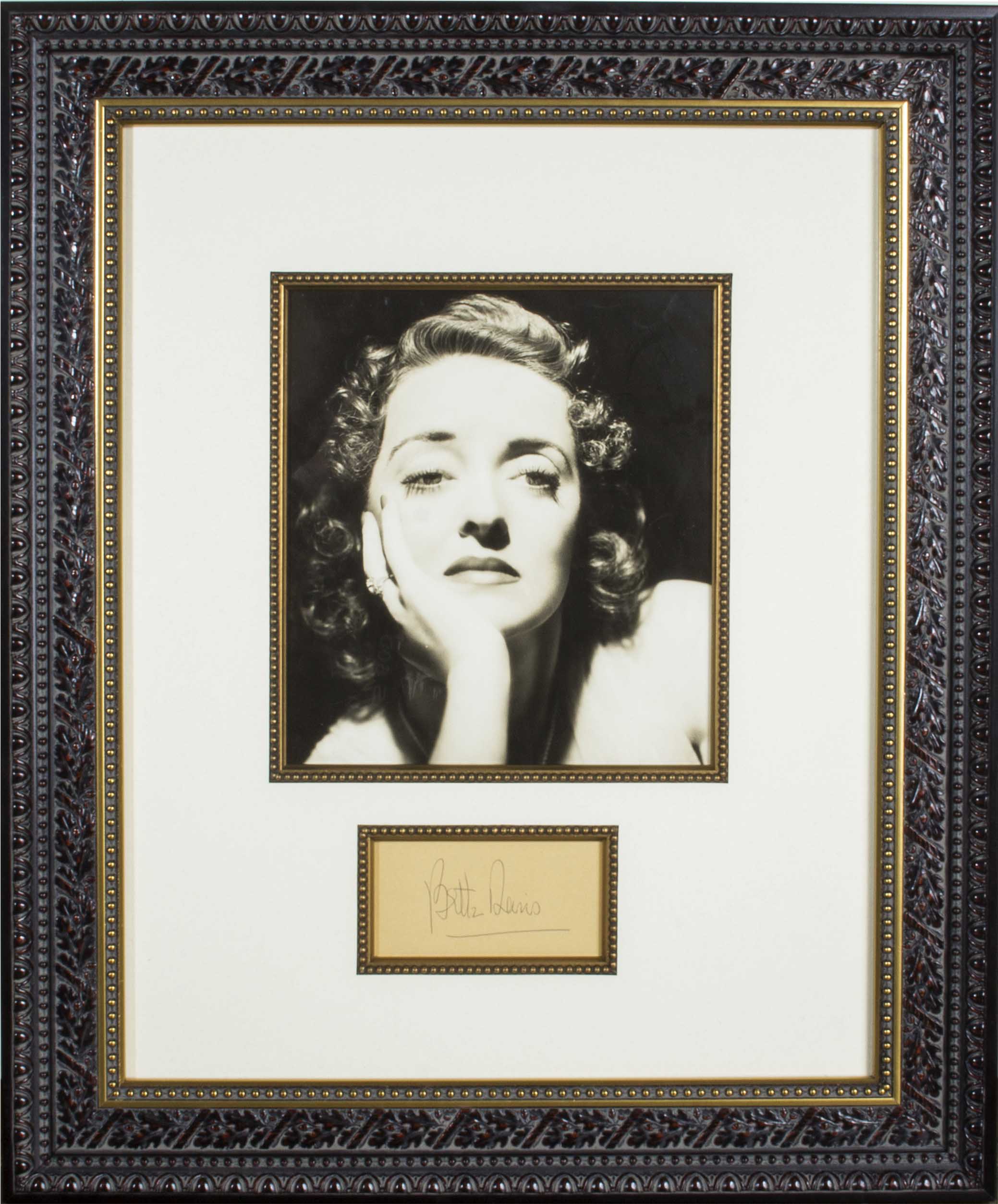 A framed photograph and autograph of Bette Davis
