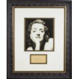 A framed photograph and autograph of Bette Davis