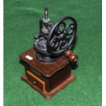 A small decorative coffee mill