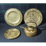 Three brass plaques and a kettle