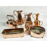 A collection of copperware items