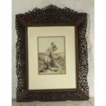An Oriental style profusely carved picture frame