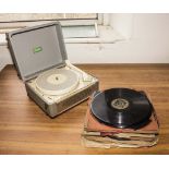 A vintage Marconiphone record player and 78" records