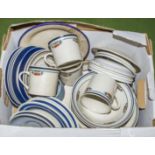 A box containing assorted tea ware