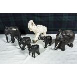 Six carved wooden elephants