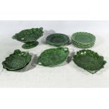 A collection of Victorian green Staffordshire Majolica pottery dishes and plates