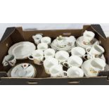 A box containing tea and coffee cups and other china