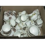 A box containing assorted tea ware