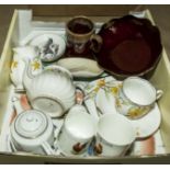 A box containing assorted tea ware