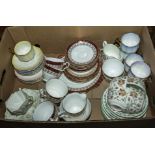 A box containing assorted tea ware