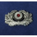 A Nazi cap badge