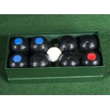 A set of mini carpet bowls