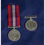 A WWII War medal and a Defence medal