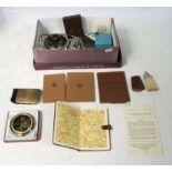 A box of collectable items, two lady's compacts, bijouterie, WWII booklets and other items