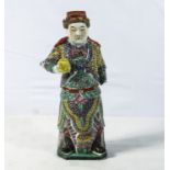 Antique Chinese famille rose figure of a mandarin holding an offering in his hand, 30cm tall