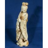 A Chinese ivory figure of lady holding basket with young dog of fo and dog of fo at her feet.20cm