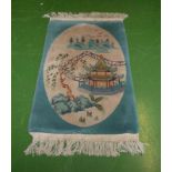 A vintage Chinese rug turquoise ground with pictorial scene