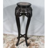 A Chinese urn stand with pink marble insert top.93 cm tall