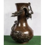 A very good quality Japanese bronze vase with dragon chasing the pearl Meiji period.50cm tall .30 cm