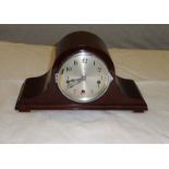 A mahogany mantle clock