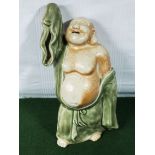 An antique Chinese Celadon glazed Buddha figure, 36cm tall