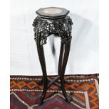 A Chinese urn stand with pink marble insert top.93 cm tall