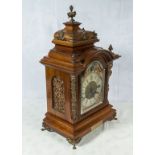 A Victorian walnut shelf clock with brass mounts, striking on two gongs. Good condition.49cm tall.