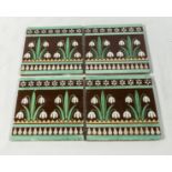 A set of four Minton's snowdrop tiles designed by Christopher Dresser, 6 inches square marks to