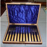 A cased set of fish cutlery