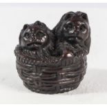 A Japanese netsuke Cat and kittens in a basket, signed