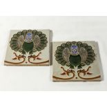 A pair of tiles by Maw & Co depicting a peacock type bird, 6 inches square