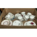 A box containing assorted tea ware