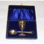 A cased Christening set comprising of silver egg cup and spoon