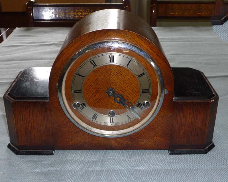 An oak mantle clock