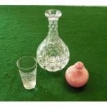 A crystal carafe and two others