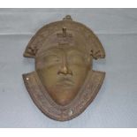 A brass wall mask from Benin City Nigeria