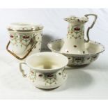 A Victorian four piece wash set including Jug, bowl, pail and chamber pot