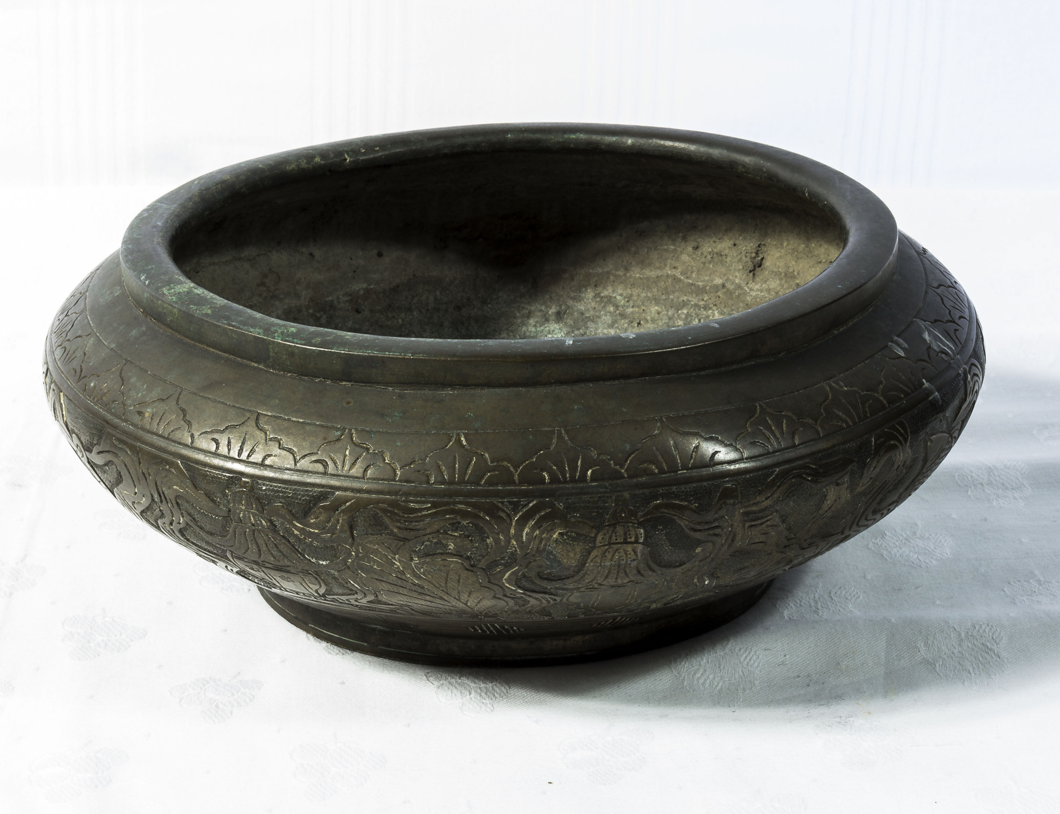 A Chinese Qing dynasty bronze censer decorated in relief