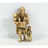 A small ivory gourd seller netsuke signed