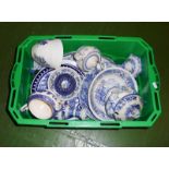 A box containing blue and white transfer pottery