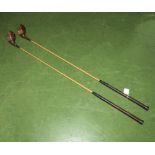 Two vintage bamboo golf clubs