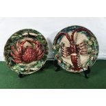 A pair of large Portuguese Majolica chargers with lobster, crab and sea creature decoration, marks