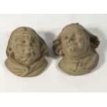 A pair of unglazed Bretby wall mask pocket vases, depicting a medieval man and woman, 12cm x 12cm