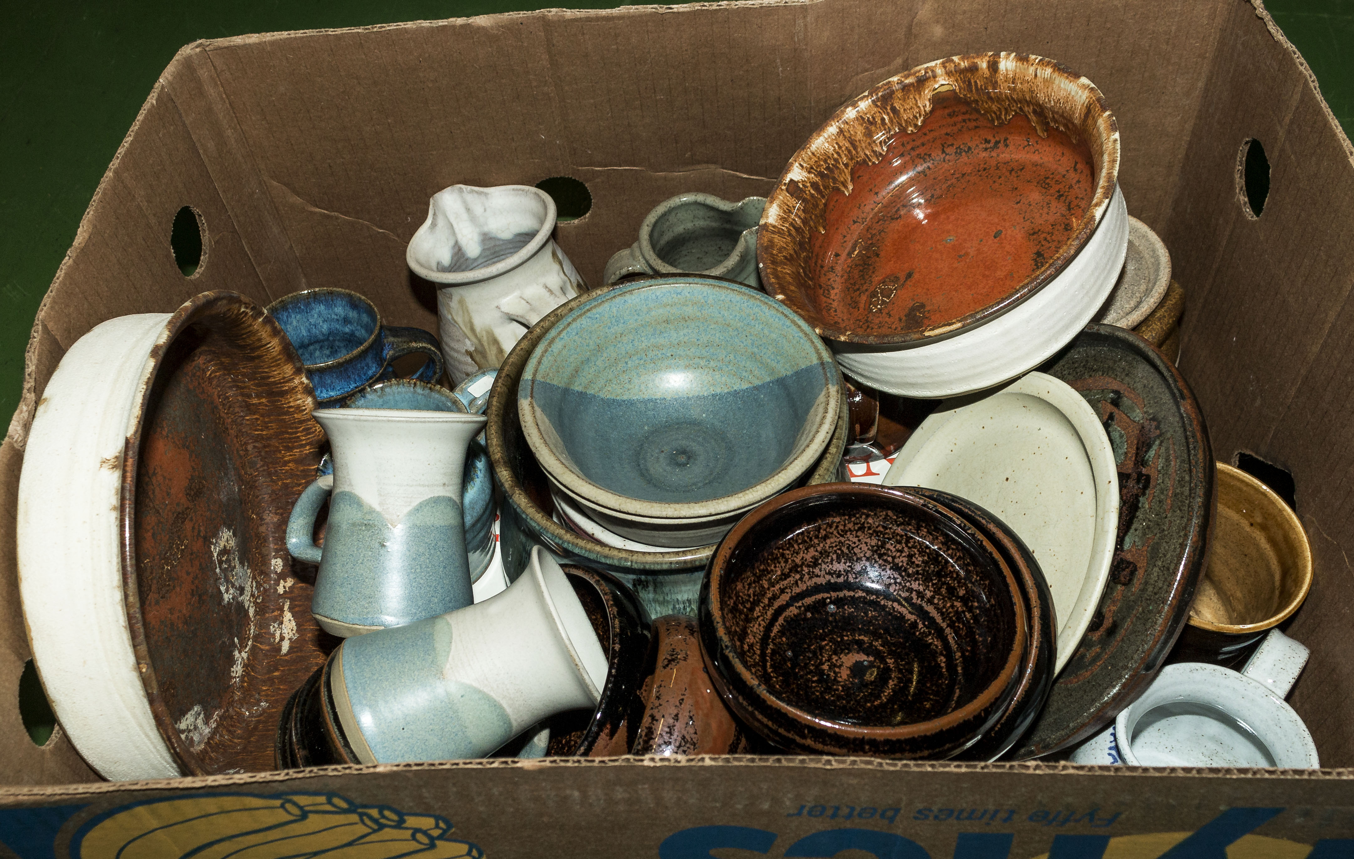A box of containing pottery items