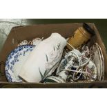 A box containing assorted pottery items