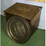 A brass log box and three brass plaques